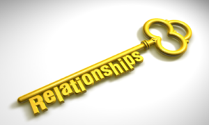 The word relationship on gold key.